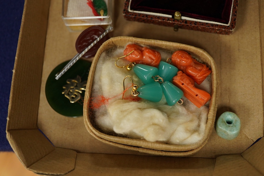 A group of jewels, comprising: three carved coral beads depicting classical women; a synthetic colour-change sapphire and paste pendant; a citrine drop pendant; a bar brooch with a scaraboid carnelian bead carved with an